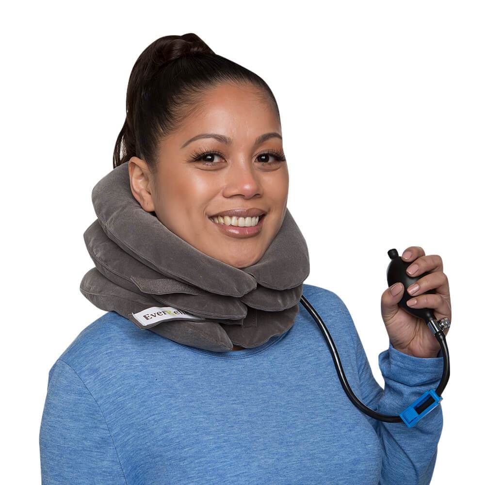 A woman with pain in her neck, back, or shoulder, pinched nerves, soreness, cervical neck spasms, herniated discs and tension in need of neck decompression traction device for at home pain therapy.